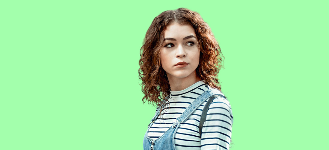 Girl with Brown Curly Hair with Green Background